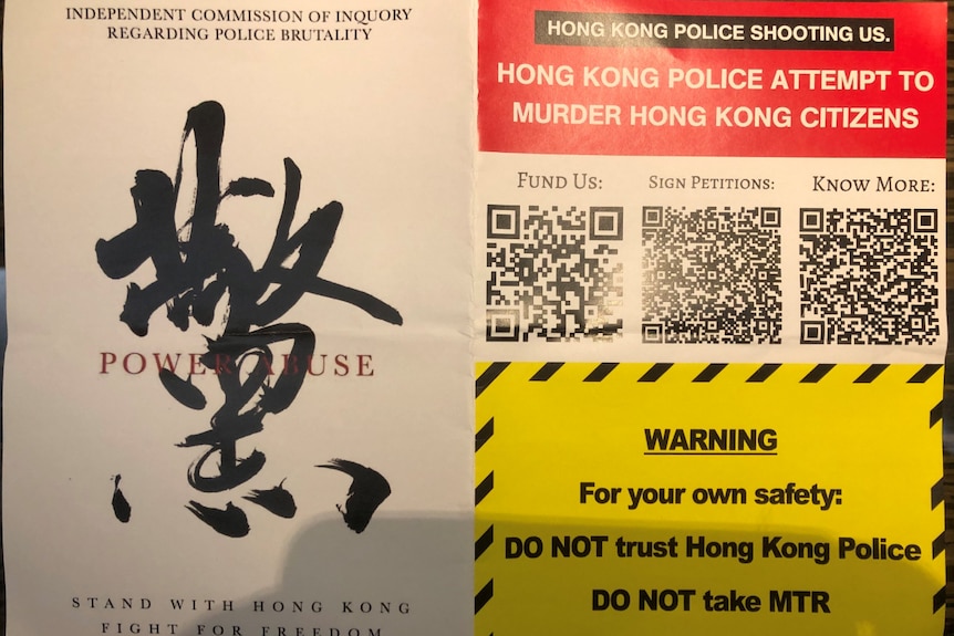 A close-up photo of a flyer says not to trust the Hong Kong police, as it calls on an inquiry into police brutality.
