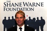 Shane Warne at an event for his foundation