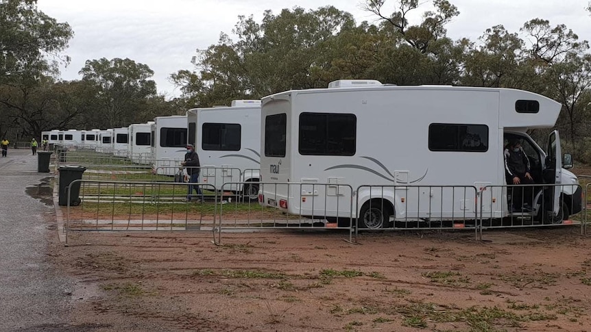 motorhomes lined up along the road