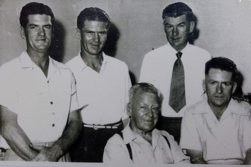 Five men in an old black and white photograph