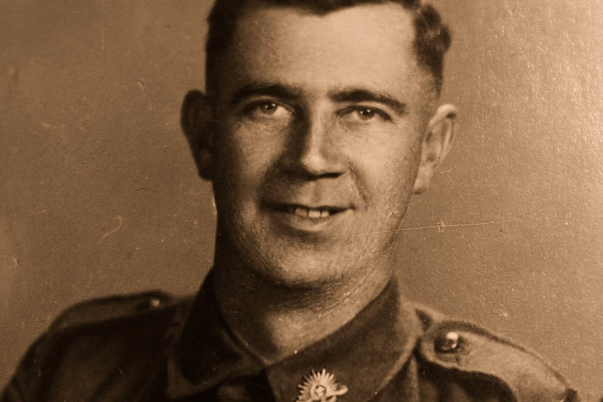 A historic sepia-toned photograph of World War II veteran Jack Darnley.