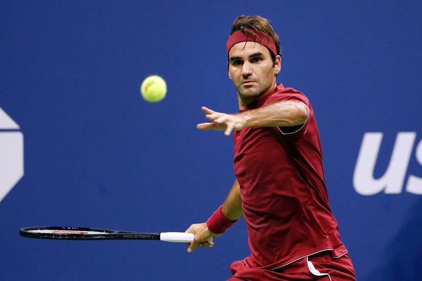 Roger Federer eyes the ball as he prepares to play a forehand against John Millman.