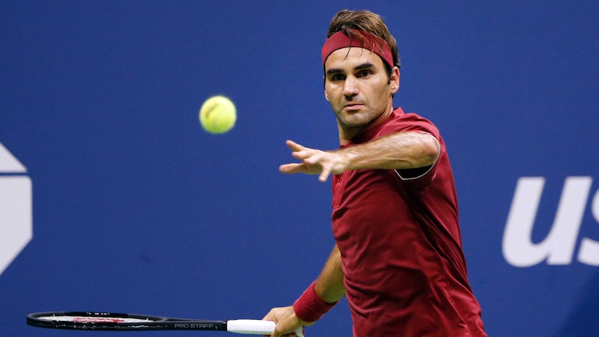 Roger Federer eyes the ball as he prepares to play a forehand against John Millman.