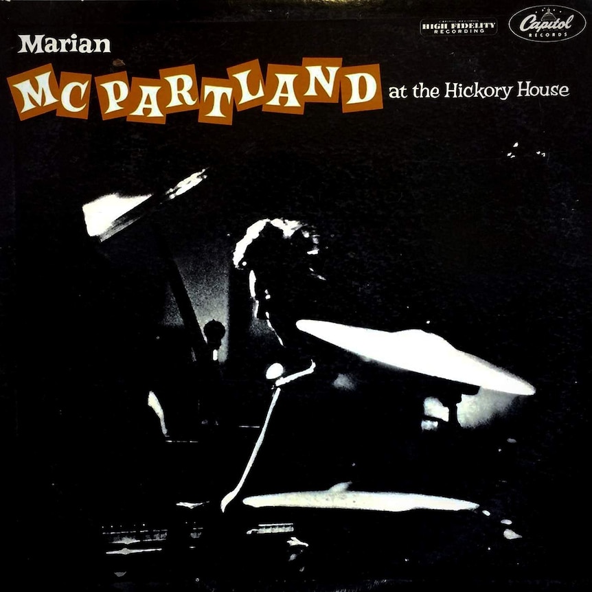 A black and white shot of Marian McPartland at the piano