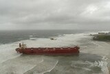 The MV Pasha Bulker aground on a reef off Nobbys Beach