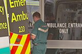 ambulance and paramedics at emergency department entrance