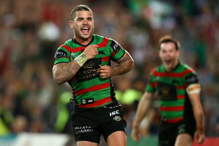 Rugby league players celebrates after winning a match 