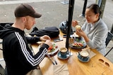 Two people eating lunch outside
