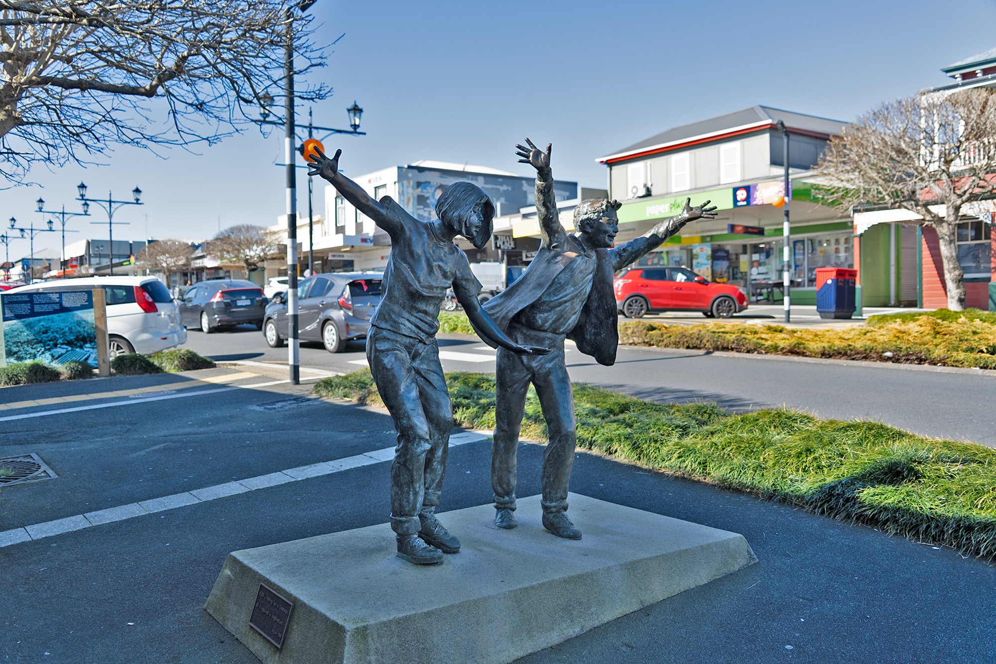 Statues line a street in New Zealand.