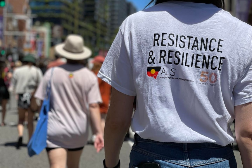 a person wearing an Aboriginal Legal Service tshirt 