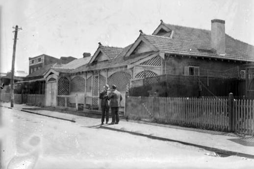 Black and white photo of house and street