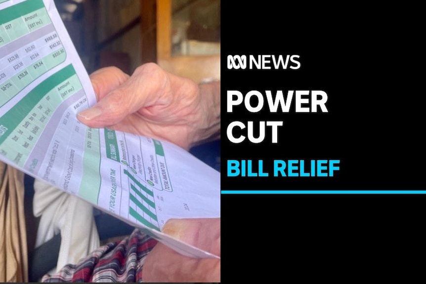 Power Cut, Bill Relief: Close up of someone holding an energy bill.
