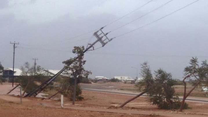 Leaning power lines after Cyclone Olwyn