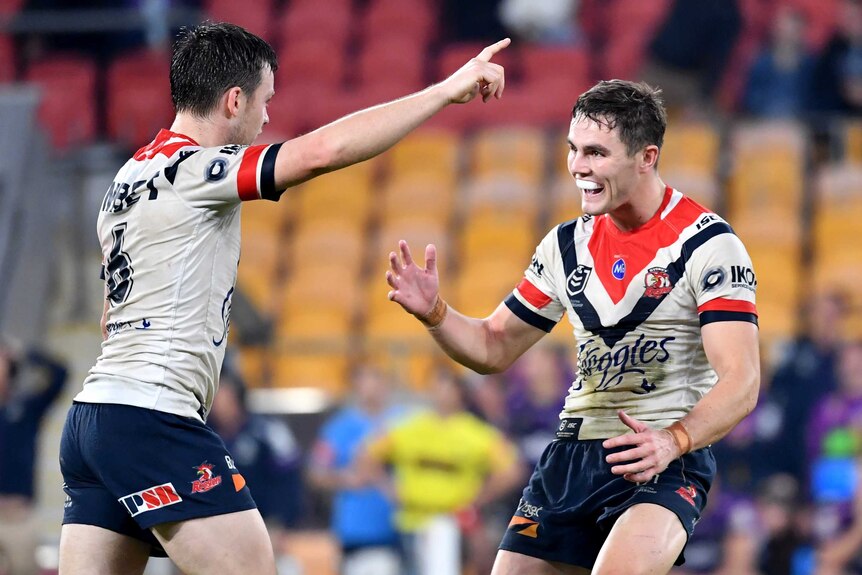 Sydney Roosters' Luke Keary points as Kyle Flanagan looks to celebrate with him.