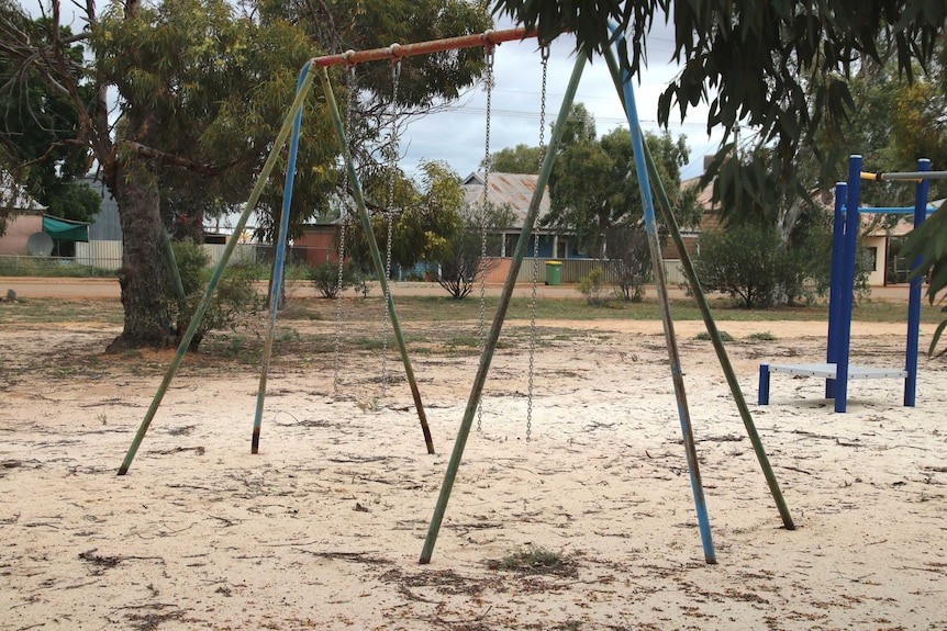 The playground at Ballidu Primary School with the seats removed from the swing set.