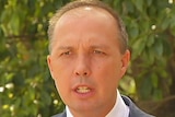 Immigration Minister Peter Dutton speaking to the media in Brisbane