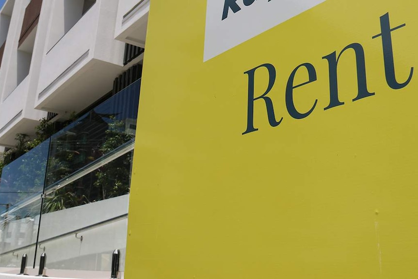 Rent sign of real estate agency outside an apartment building in Brisbane