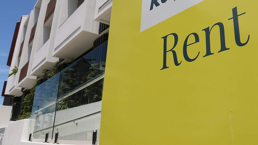 Rent sign of real estate agency outside an apartment building in Brisbane