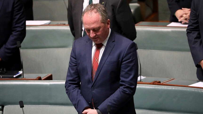 Barnaby Joyce bows his head for the morning prayer inside the House of Representatives