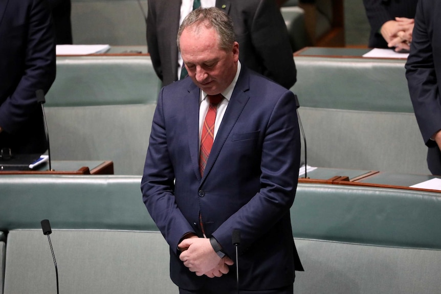 Barnaby Joyce bows his head for the morning prayer inside the House of Representatives