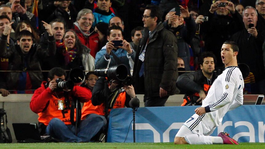 Real Madrid's Cristiano Ronaldo celebrates scoring a penalty against Barcelona in the King's Cup.