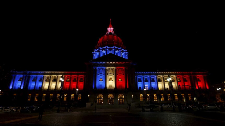 San Francisco City Hall lit up in blue, white and red colours