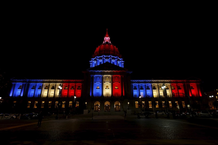 San Francisco City Hall lit up in blue, white and red colours