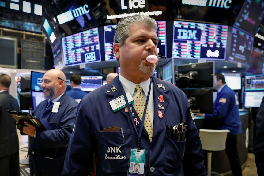 Blowing bubbles Traders work on the floor of the New York Stock Exchange in New York.