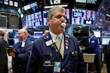 Traders work on the floor of the New York Stock Exchange in New York.