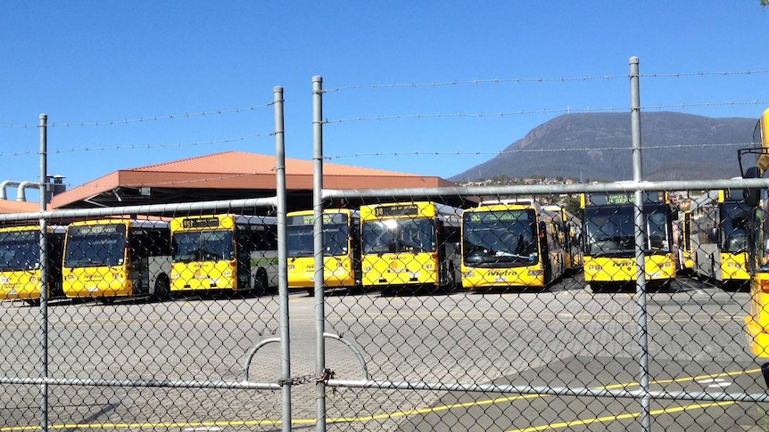 Metro Tasmania  buses parked behind a fence during a stop-work meeting by Hobart drivers