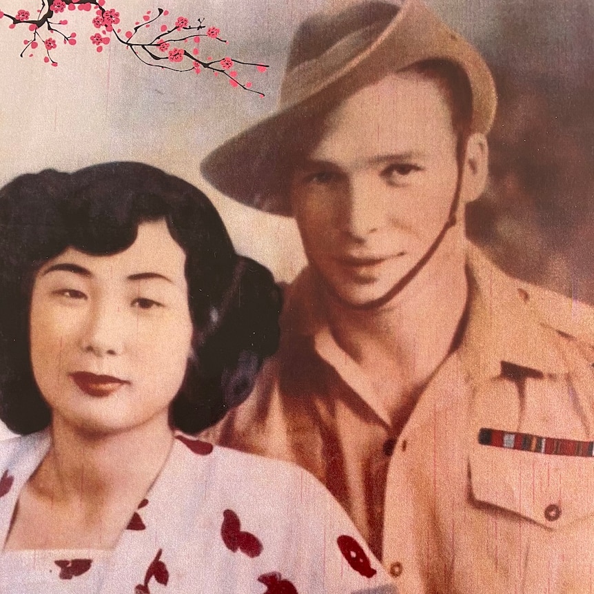 A Japanese woman sits closely to an Australian male soldier whose in uniform.