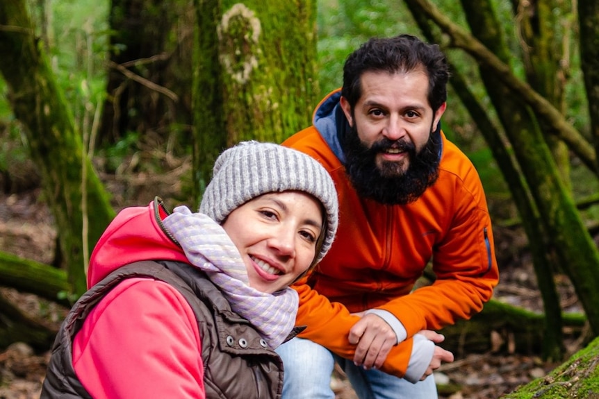 A man and a woman in a forest