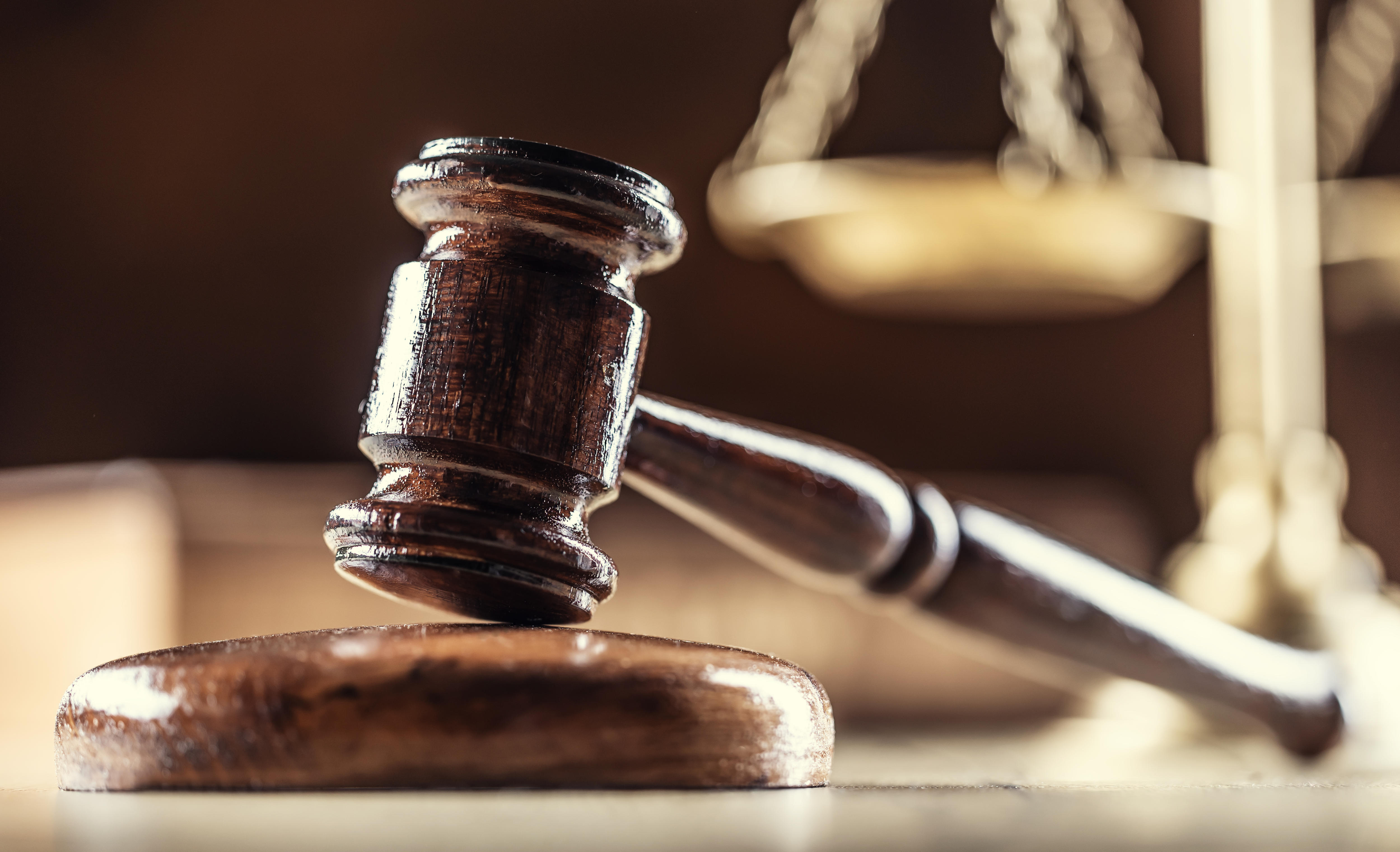 The judge's gavel and scales as a symbol of the judiciary and justice