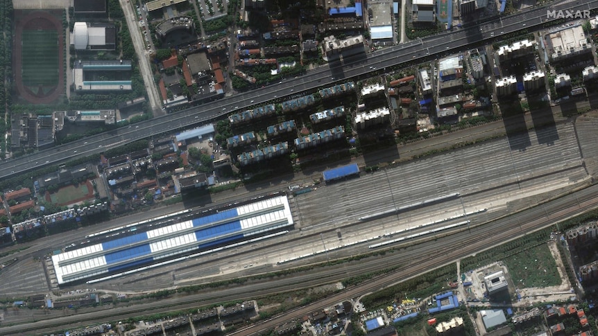 Satellite imagery shows few trains on the line at Wuhan train station.
