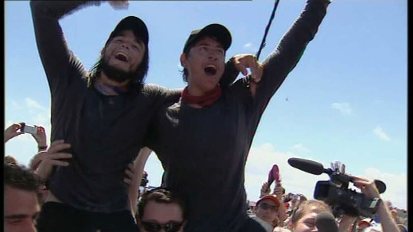 James Castrission and Justin Jones celebrate after kayaking the Tasman