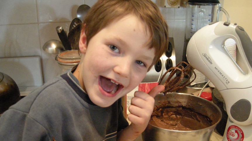 Matt Cook making a cake as a child for a story about the benefits of teaching kids to cook from a young age