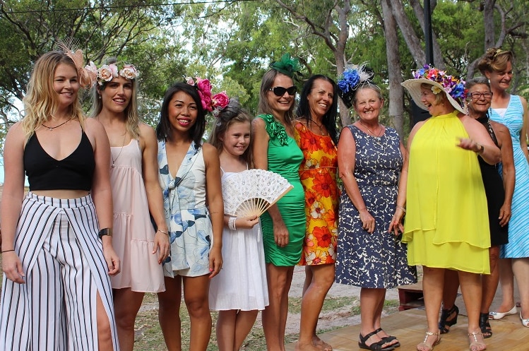 A group of women showing off their fashion on the field at the Cape York Cup in 2016