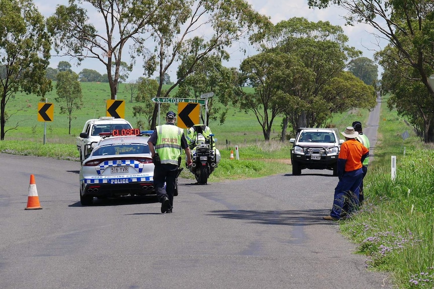 Police road block about two kilometres away from a property where an irrigation dam was leaking.