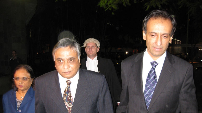 Jayant Patel (c) arrives at the Brisbane Supreme Court with his wife Kishoree