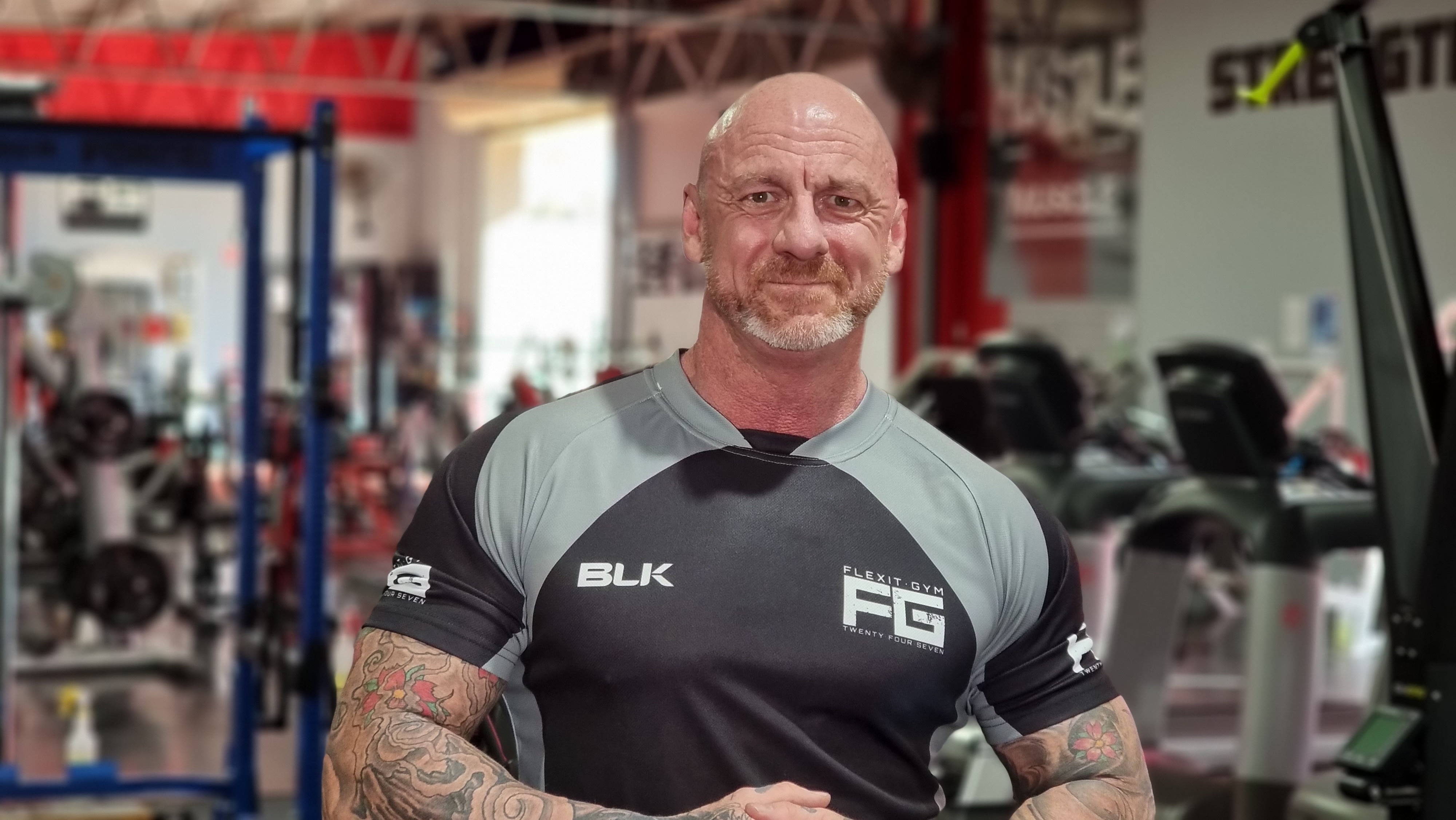 Wagga gym owner standing with hand together in the gym