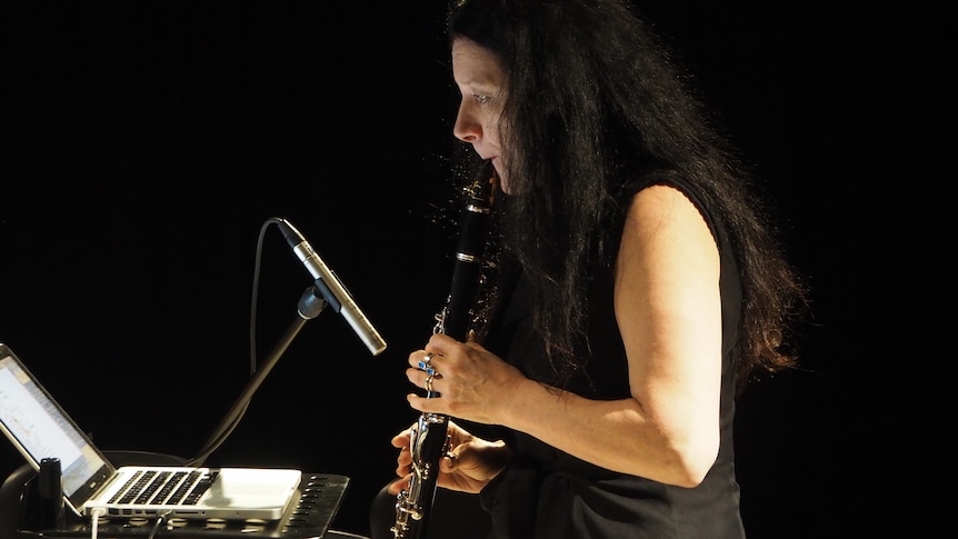 Brigid Burke playing clarinet and laptop (ABC studio 227, ACMC 2015. Photo Jon Drummond)