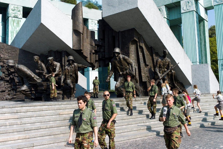 Polish scouts visit the Warsaw Uprising monument on a field trip.