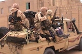 A TV grab shows a pick up truck carrying fighters of the Islamist group Ansar Dine, on April 3, 2012 in Timbuktu.