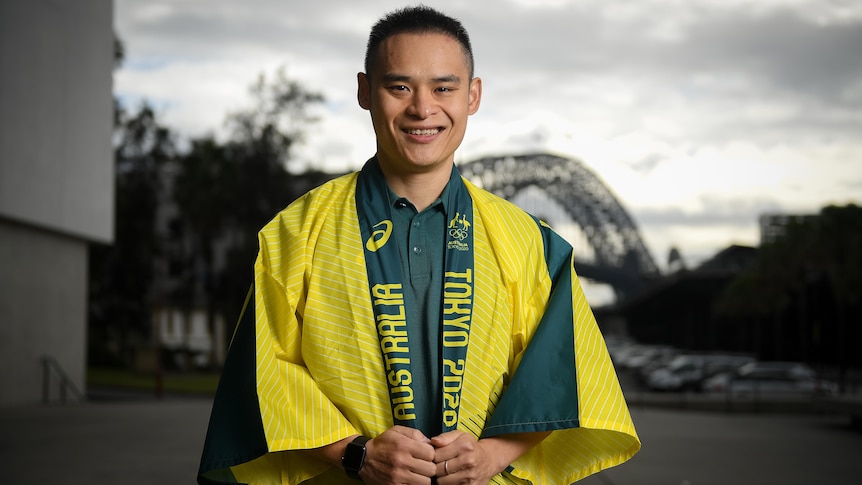 Man smiling for a photo after being selected to compete for Australia at the Tokyo Olympic Games for diving