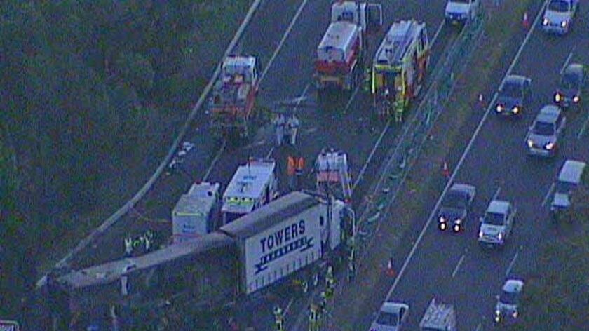 A family of three has been killed in a fiery crash with a truck north of Sydney.