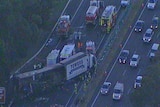 A family of three has been killed in a fiery crash with a truck north of Sydney.