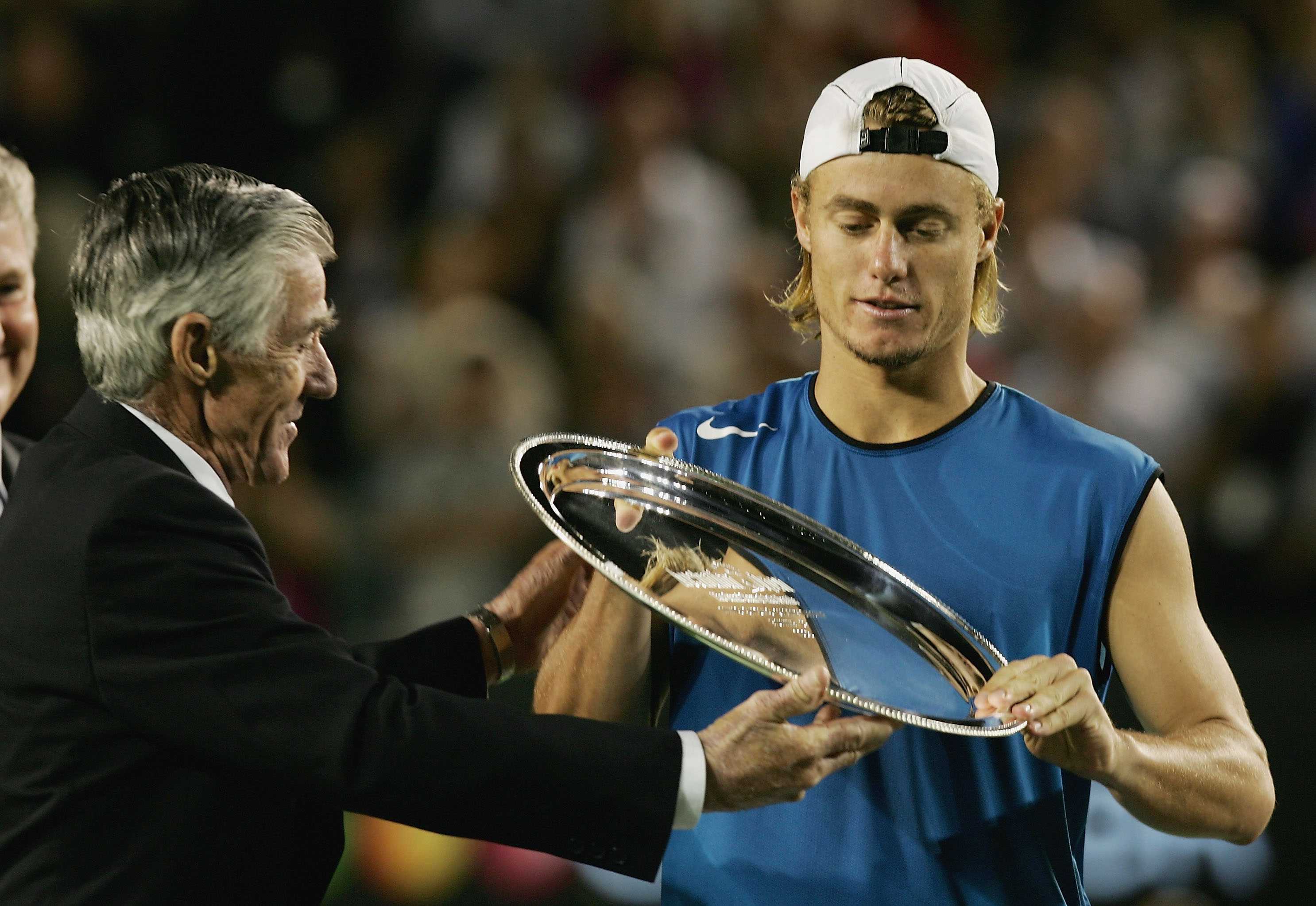 Lleyton Hewitt receives trophy from Ken Rosewall after losing the 2005 Australian Open men's final.