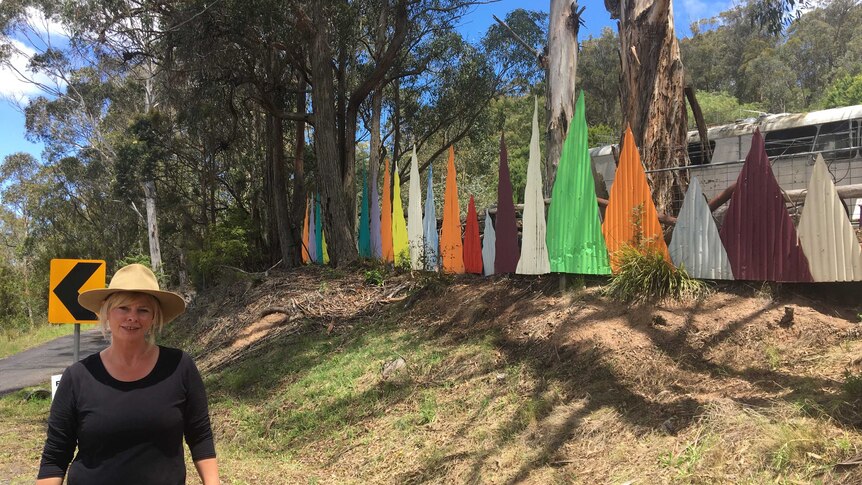 The entrance of the xmas tree bob is lined with a rainbow colourful geometric fencing