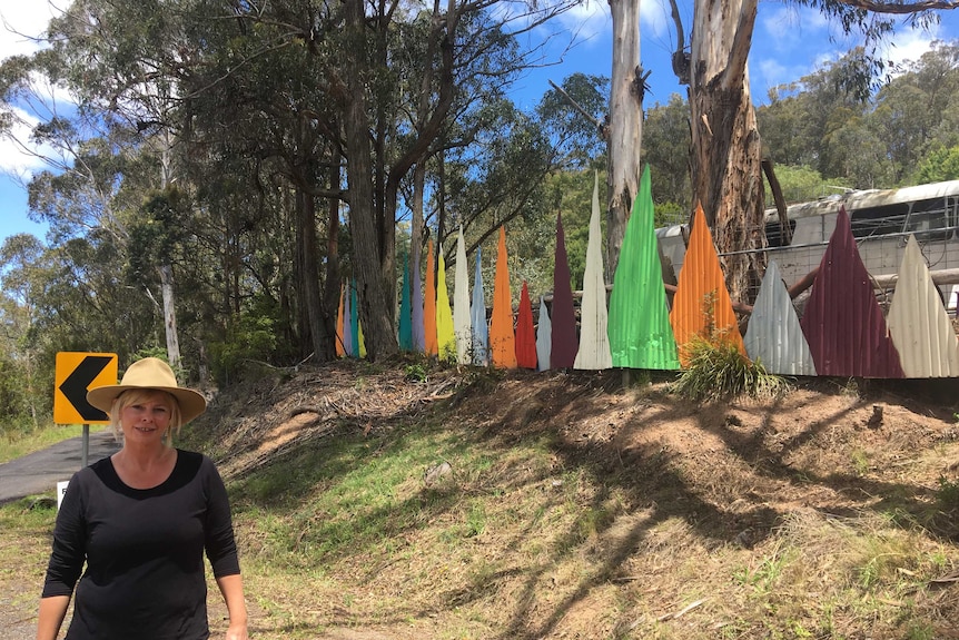 The entrance of the xmas tree bob is lined with a rainbow colourful geometric fencing