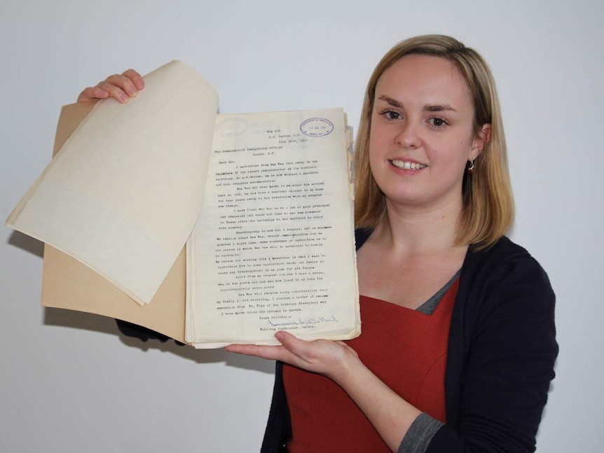 National Archives of Australia curator Michelle Hughes with files relating to Bas Wie.